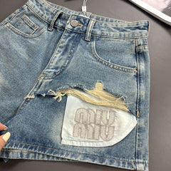 Denim shorts with rhinestone pocket design