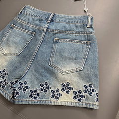 Camellia embroidered denim shorts