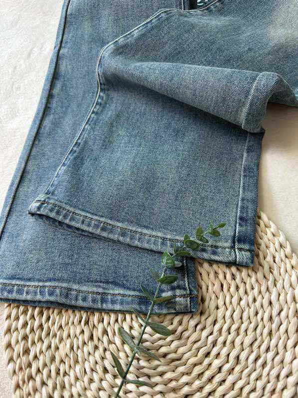 Raw-edge denim flared pants