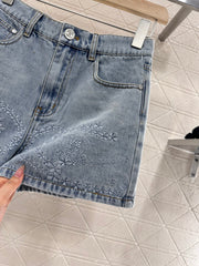 Camellia embroidered denim shorts