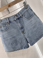 Camellia embroidered denim shorts