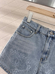 Camellia embroidered denim shorts