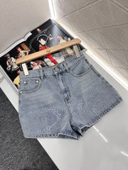 Camellia embroidered denim shorts