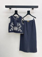Sleeveless vest + skirt