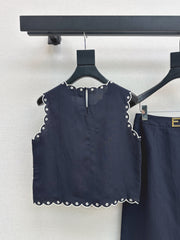 Sleeveless vest + skirt