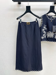 Sleeveless vest + skirt
