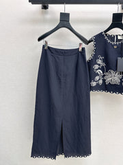 Sleeveless vest + skirt