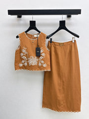 Sleeveless vest + skirt