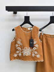 Sleeveless vest + skirt