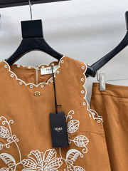Sleeveless vest + skirt