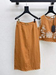 Sleeveless vest + skirt