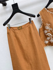 Sleeveless vest + skirt