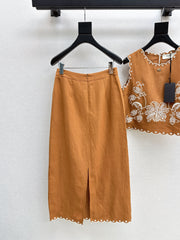 Sleeveless vest + skirt