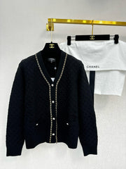 Simple knitted cardigan with chain detail