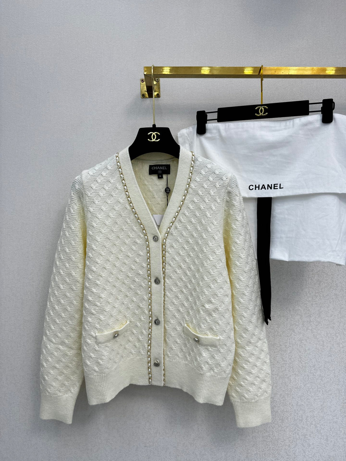 Simple knitted cardigan with chain detail
