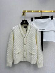 Simple knitted cardigan with chain detail