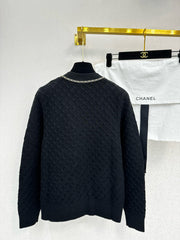 Simple knitted cardigan with chain detail