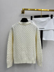 Simple knitted cardigan with chain detail