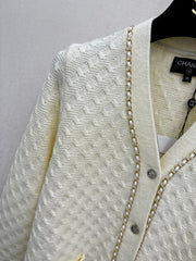 Simple knitted cardigan with chain detail