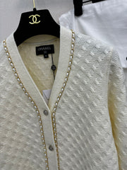 Simple knitted cardigan with chain detail