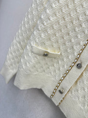 Simple knitted cardigan with chain detail