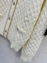 Simple knitted cardigan with chain detail