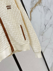 Hand-crocheted jacket with vintage suede patchwork