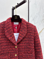A red woven jacket with a Christmas vibe