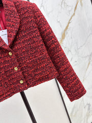 A red woven jacket with a Christmas vibe