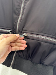 Zippered jacket with padded outerwear.