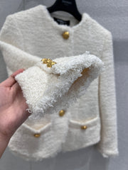 Gold-buttoned, slim-fit cropped tweed jacket.