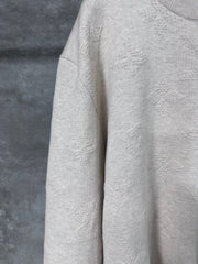 Embossed pattern sweater