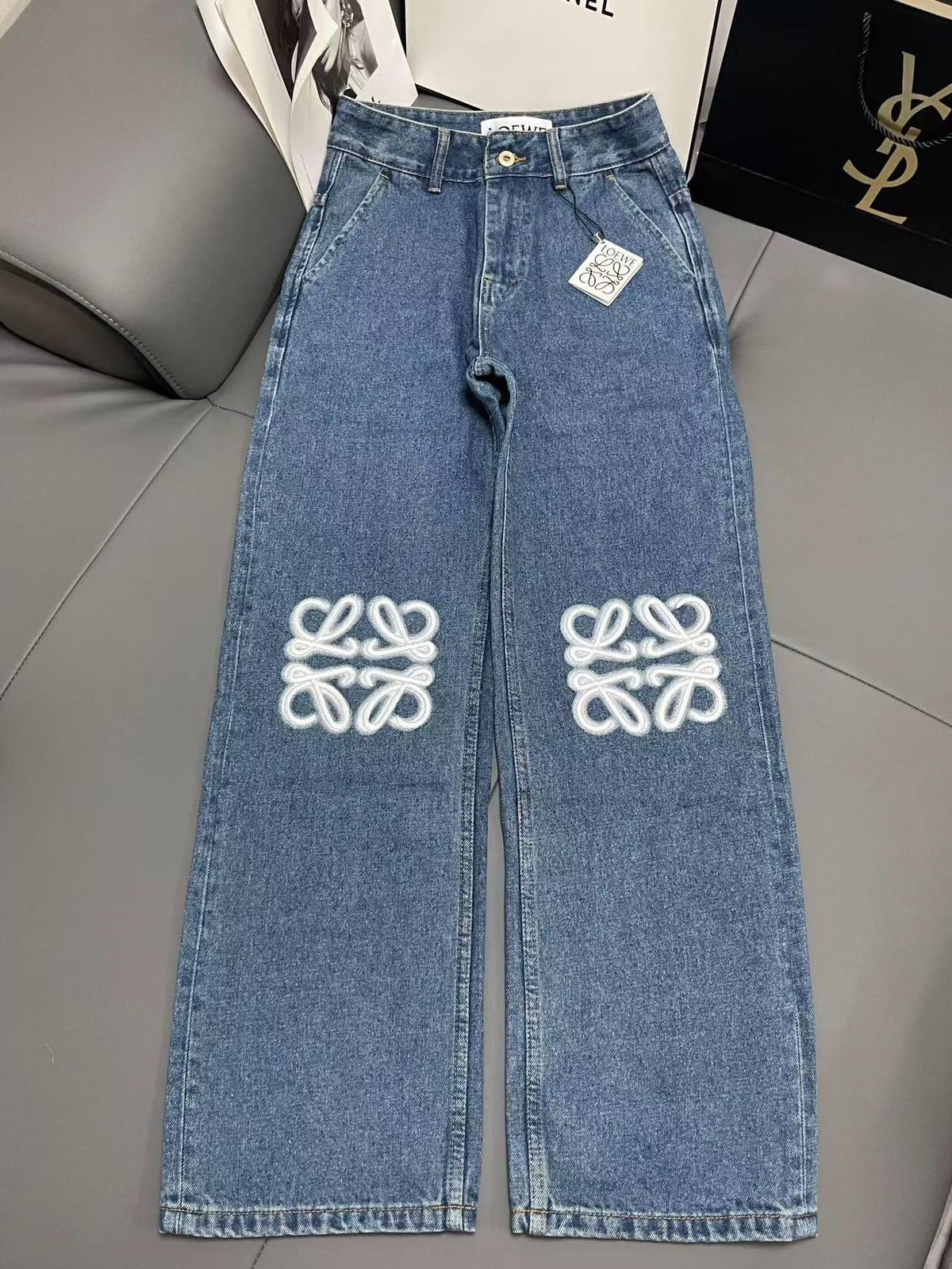 Jeans with embroidered logo at knee