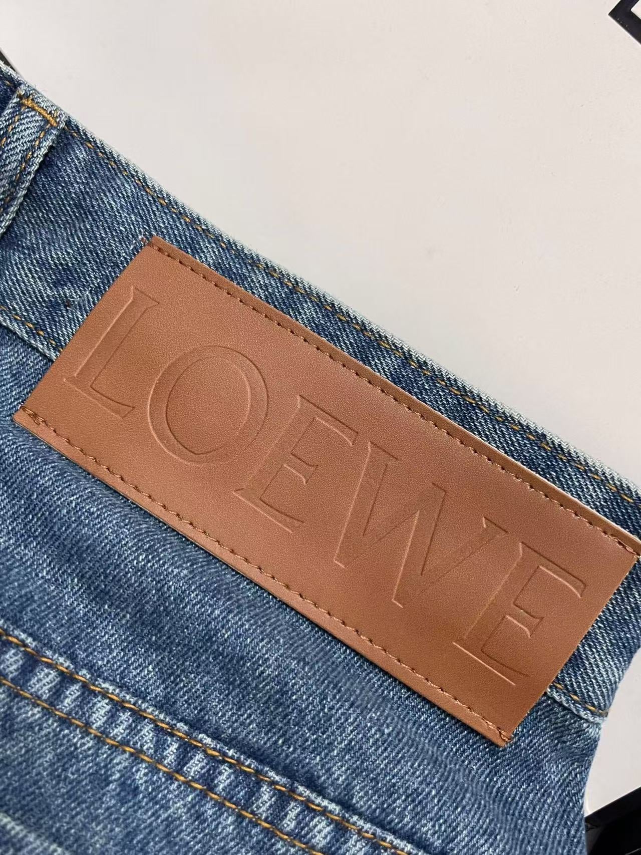 Jeans with embroidered logo at knee